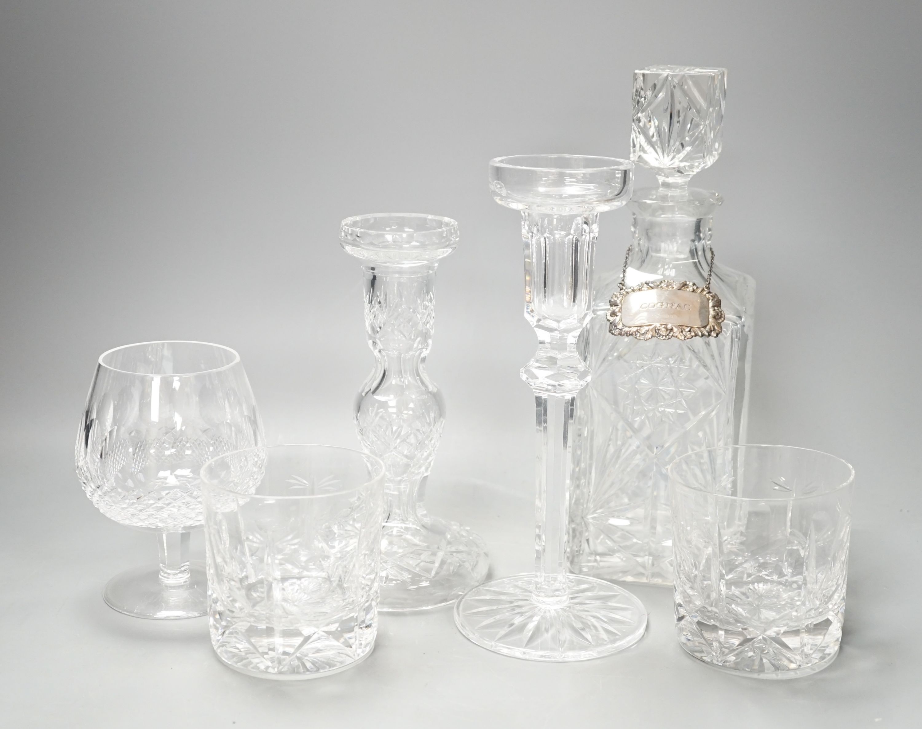 Assorted glassware including six decanters, each with a modern silver wine label